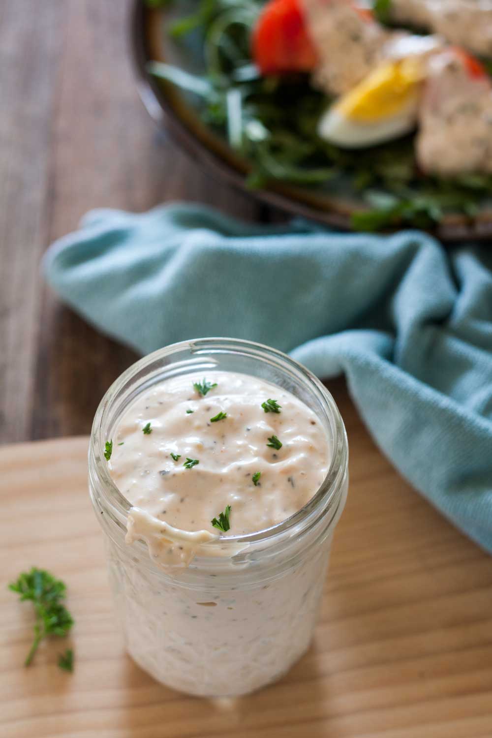 thousand island dressing in jar with salad