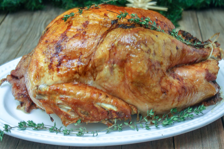 Roasted Turkey on platter with herbs