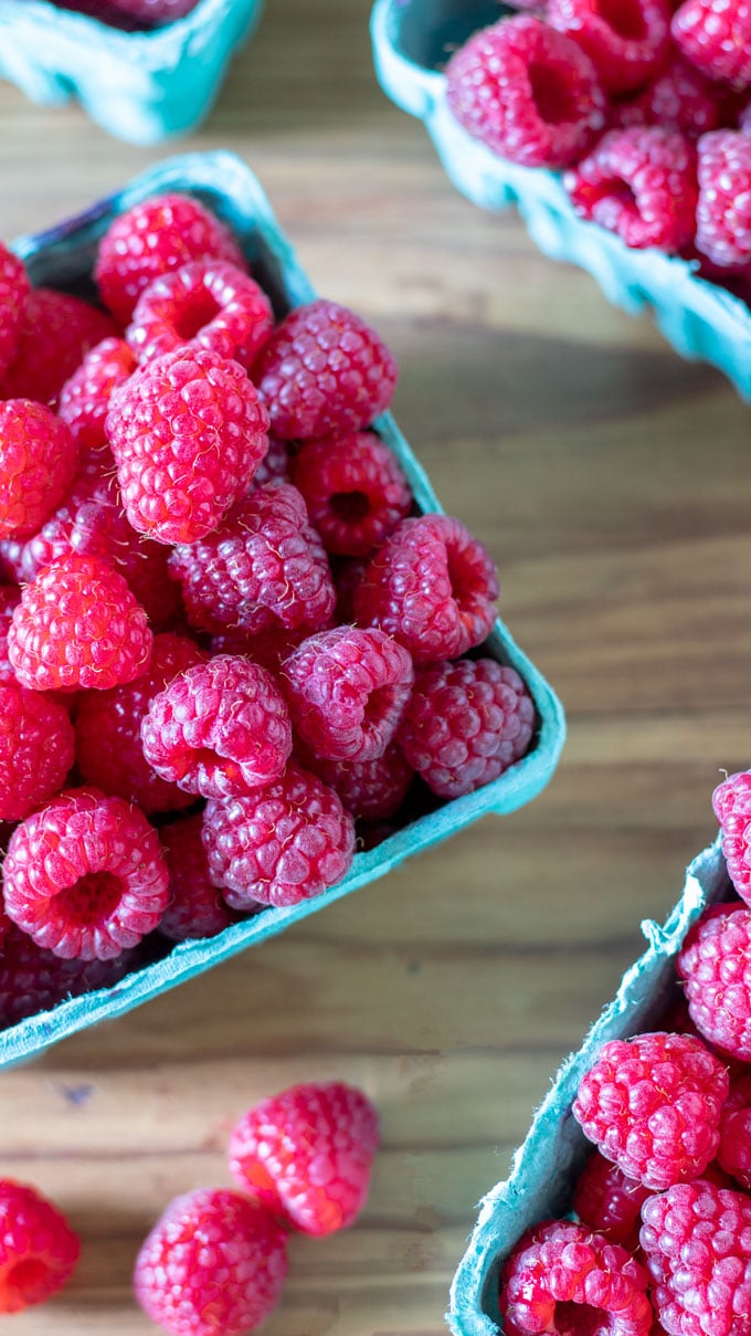 Fresh raspberries in baskets.