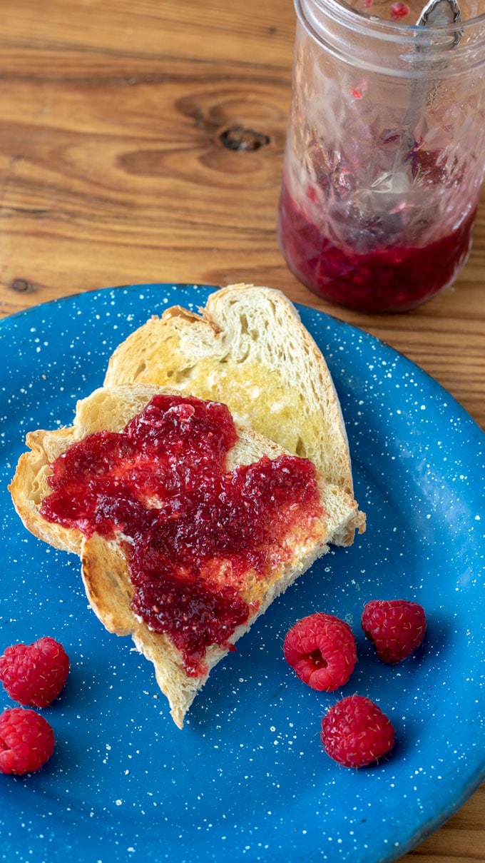 Raspberry jam spread on toast.