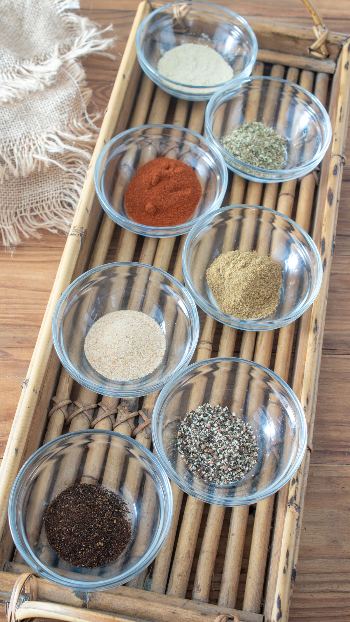 dobo seasoning ingredients in small bowls in a basket. Adobo seasoning ingredients in small bowls in a basket.
