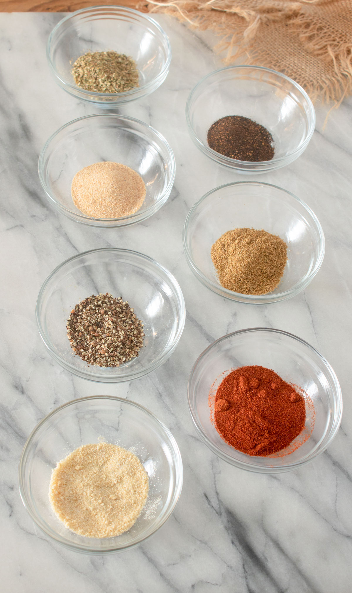 Spices in individual piles on marble board. Spices in individual piles on marble board.