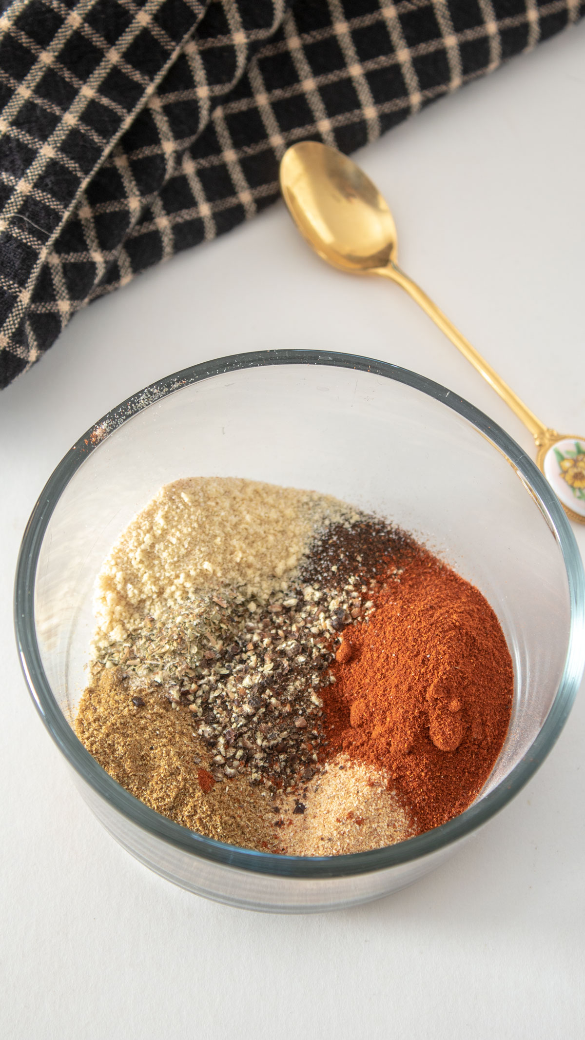 Adobo seasoning ingredients in small glass ramekins. Adobo seasoning ingredients in small glass ramekins.