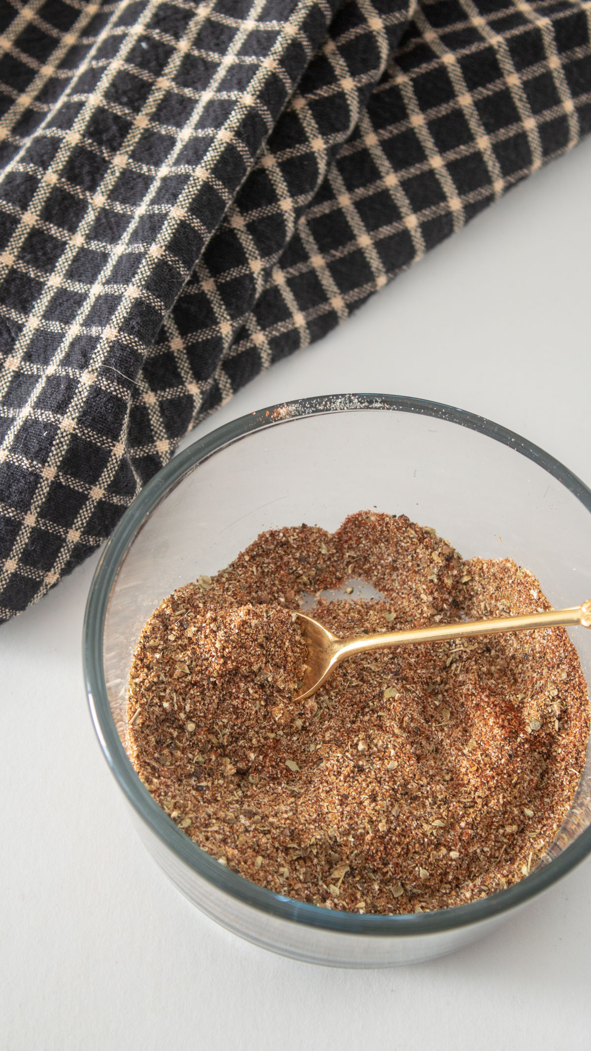 Spices in individual piles on marble board. Spices for adobo seasoning in individual piles on marble board.