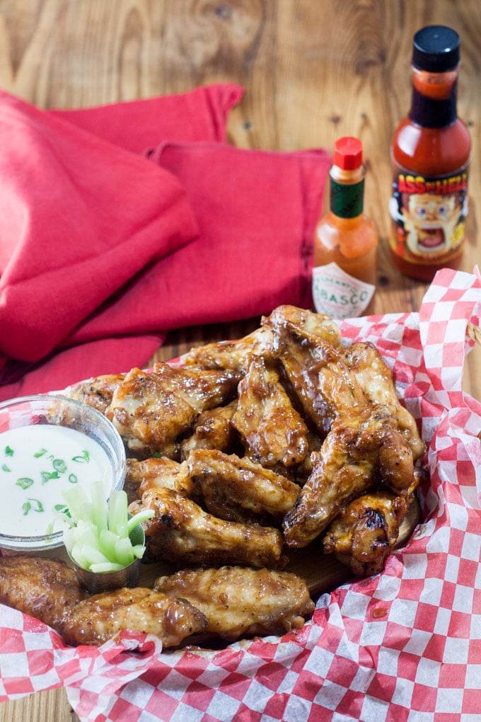 Basket full of air fried chicken wings in basket.