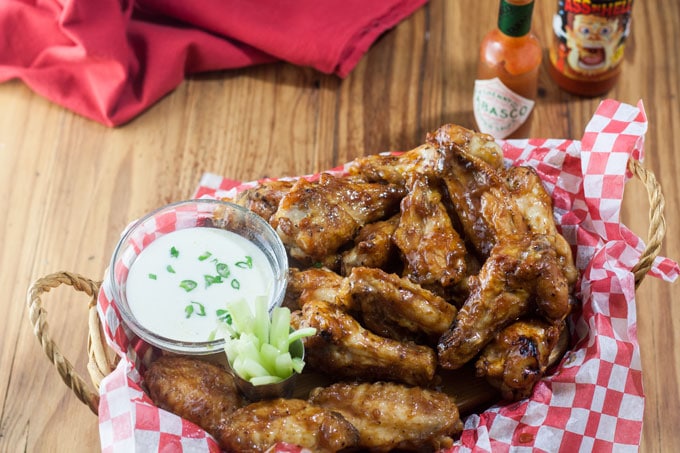 Air fryer chicken wings in basket.