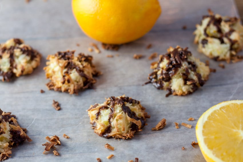 Golden brown ambrosia macaroons with oranges and chocolate drizzle