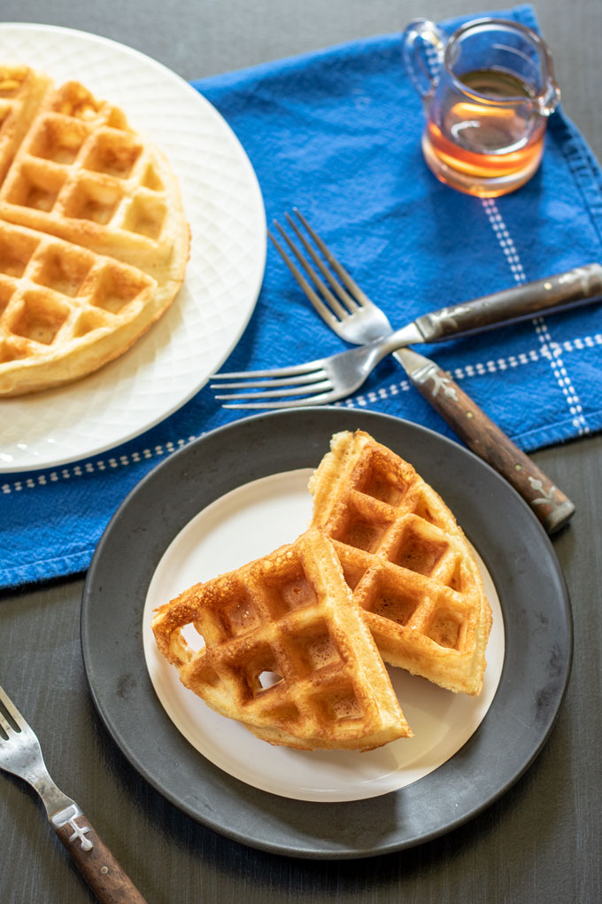 2 waffle quarters on white plate with black trim
