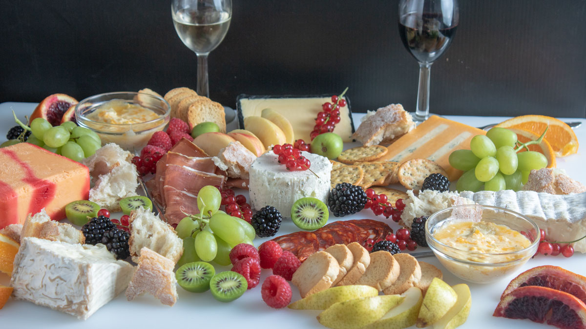 Grazing board with meats, cheeses and fruits.