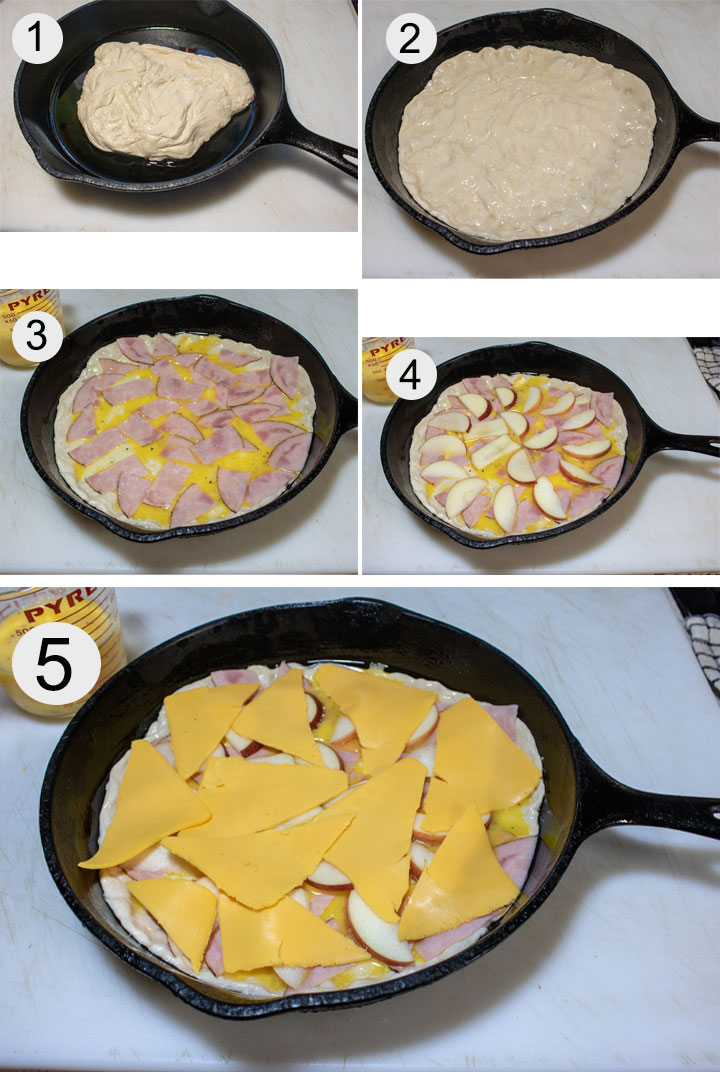 Pizza dough placed in oiled cast iron pan. Dough spread all over bottom of pan. Eggs poured onto dough and topped with ham. Ham is topped with apple. Cheese added to top of pizza.