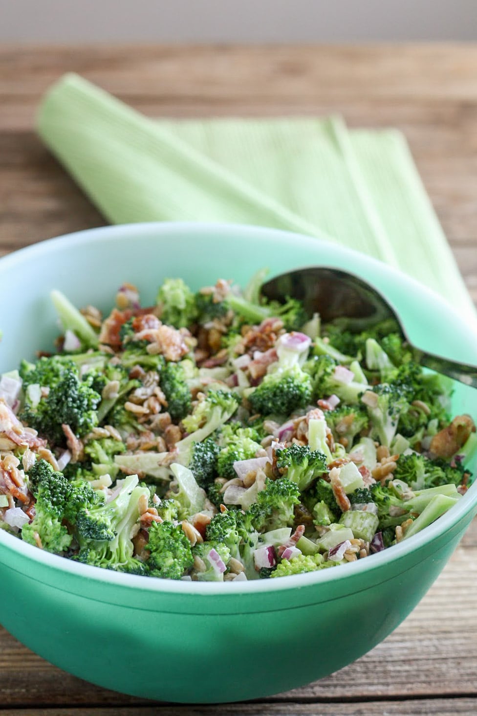 Broccoli salad in green bowl for 4th of july recipe