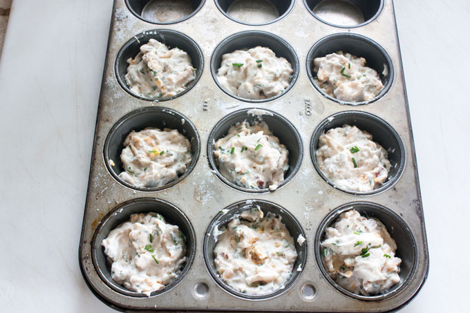 Muffin tins filled with batter.