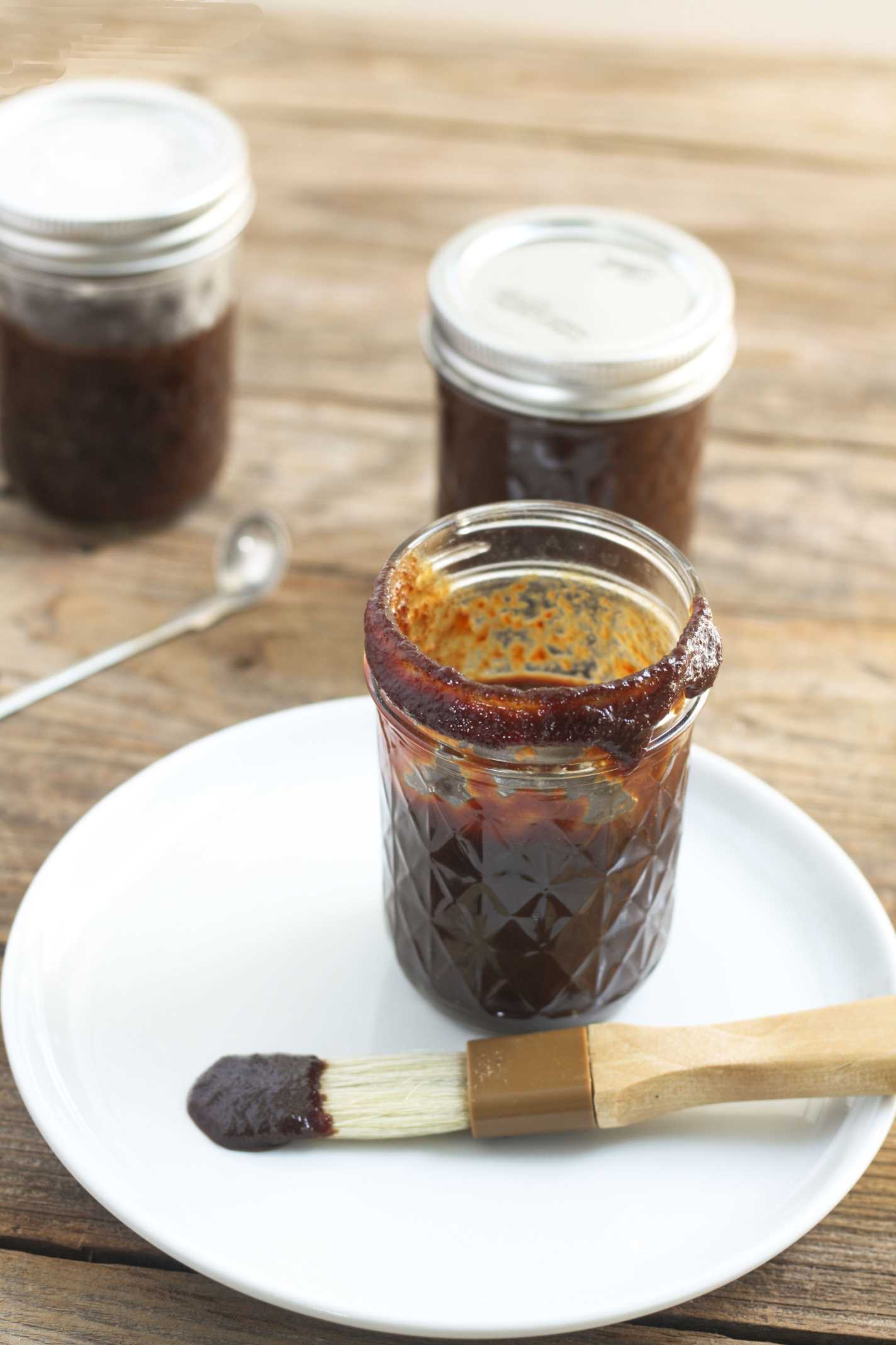 brush dipping in Cherry BBQ Sauce 