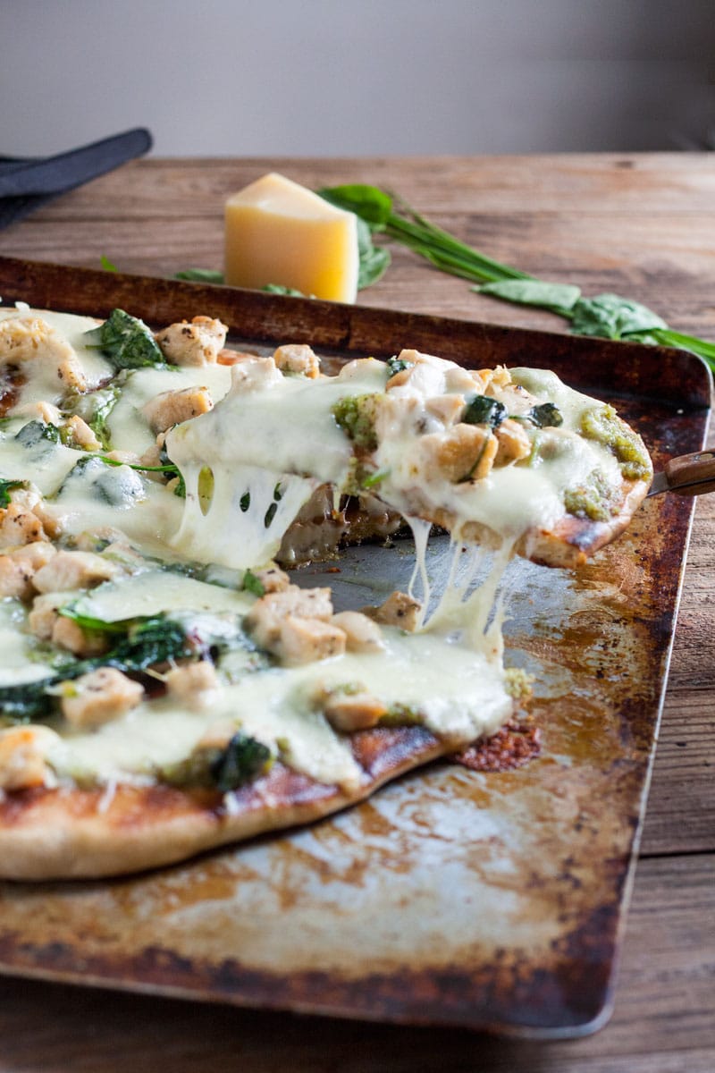 Chicken Florentine Pizza cut on baking sheet