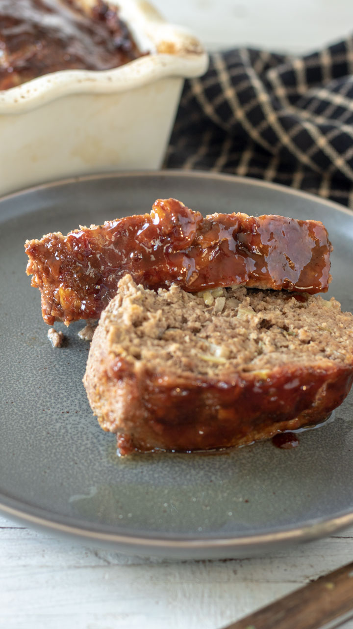 2 slices of meatloaf on grey plate.