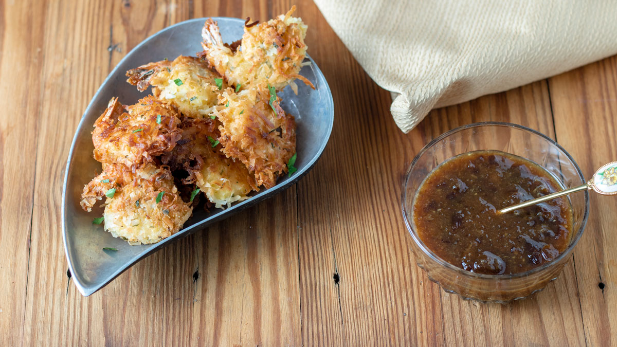 Coconut Shrimp with Lemon Marmalade Dipping Sauce in a small bowl