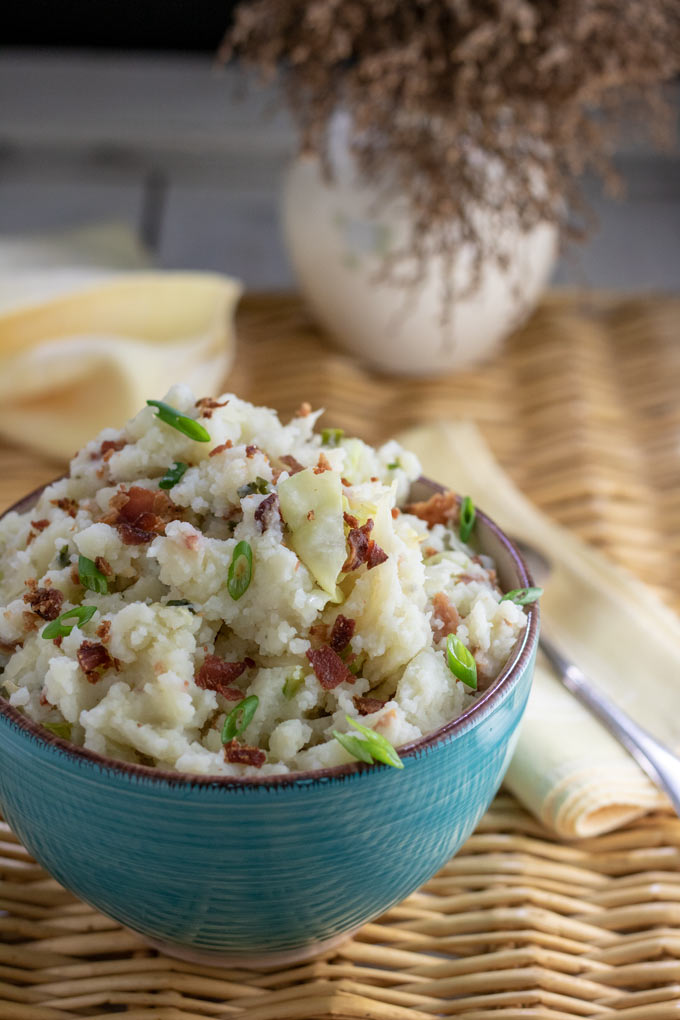 mounded colcannon with scallion and bacon garnish