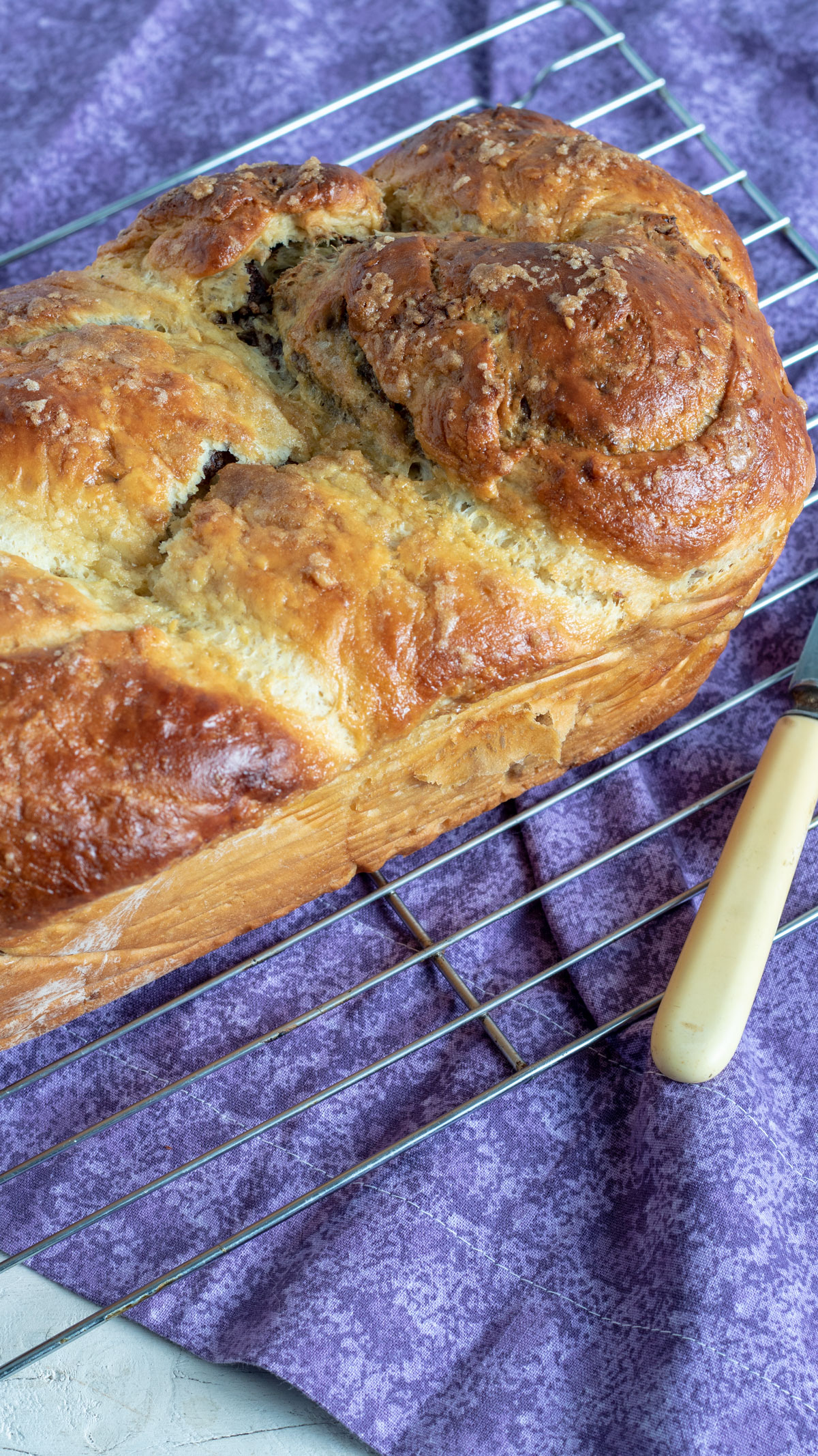 Whole cozonac bread white purple towel.
