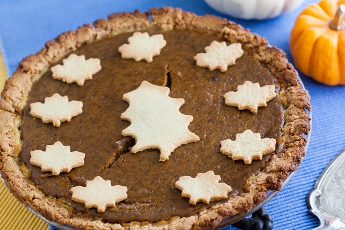 whole pumpkin pie with crust leaves for garnish 