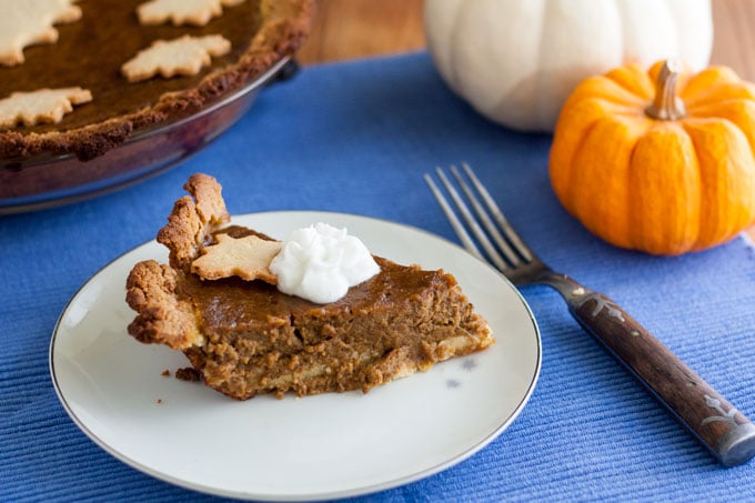slice of pie with dollop of cream on top