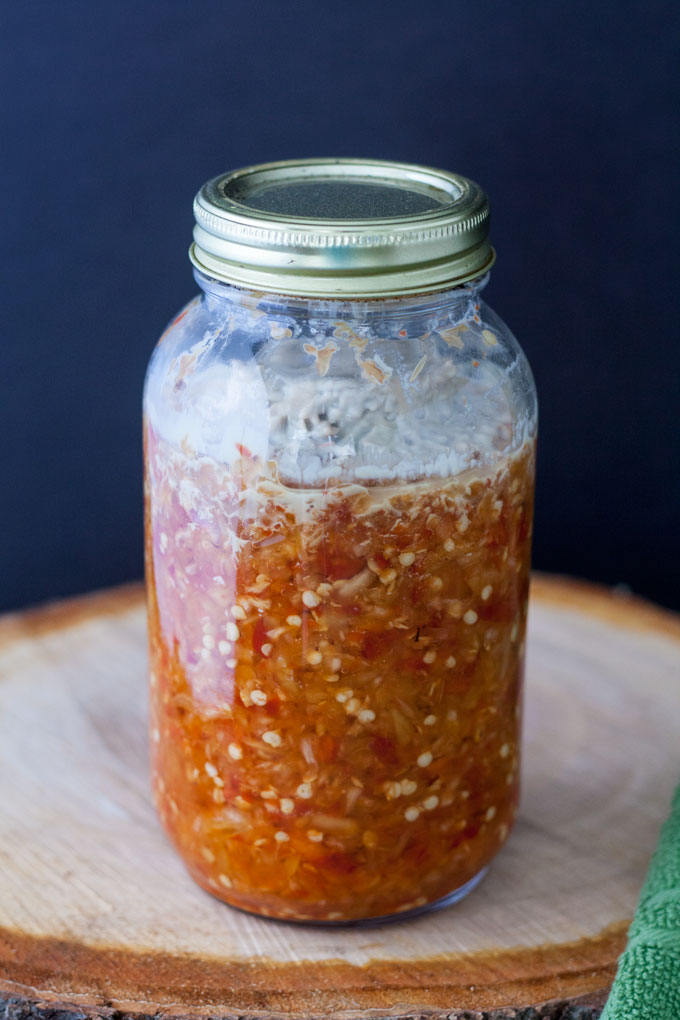 Jars of peppers that has become moldy.