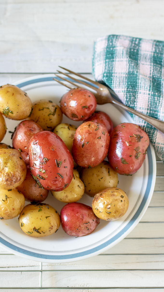 grilled potatoe on white plate.