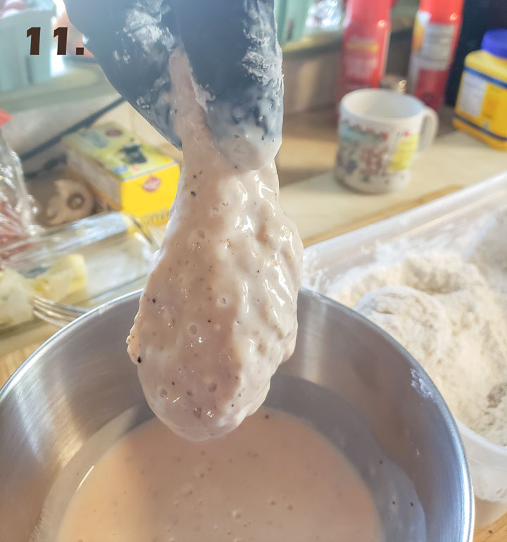 Chicken dipped in marinade.