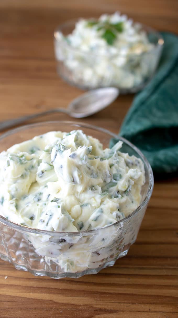 2 crystal bowls with Garlic Scape Herb Compound Butter.