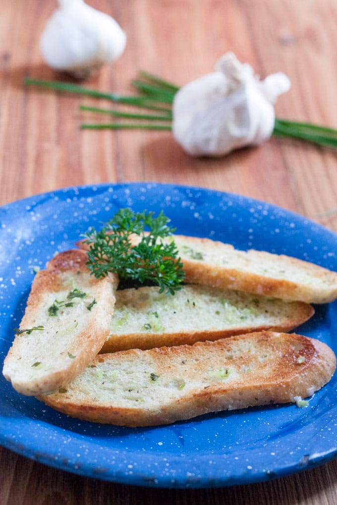 Garlic Scape Herb Compound Butter on Italian bread slices, toasted