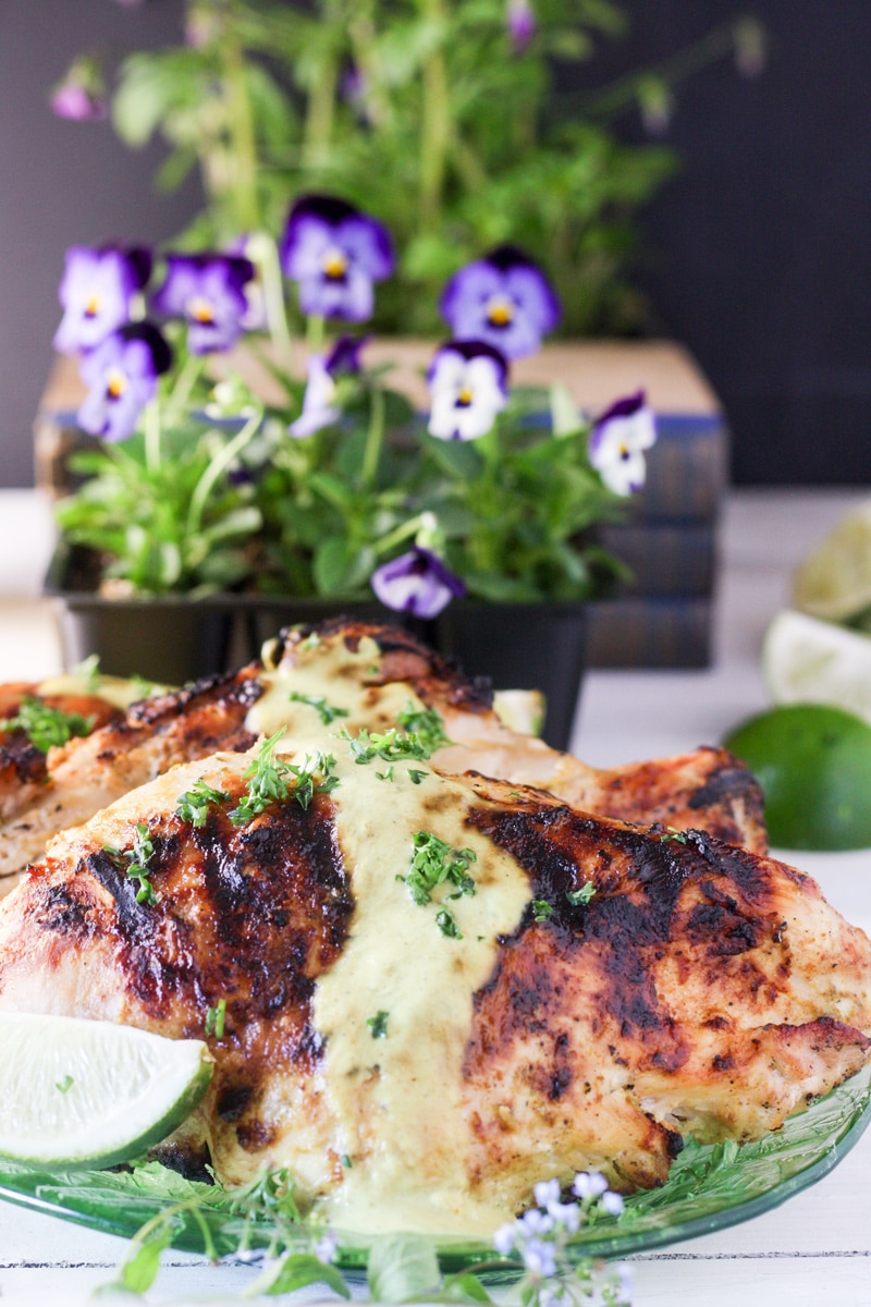 Whole chicken breast pieces on green depression glass platter