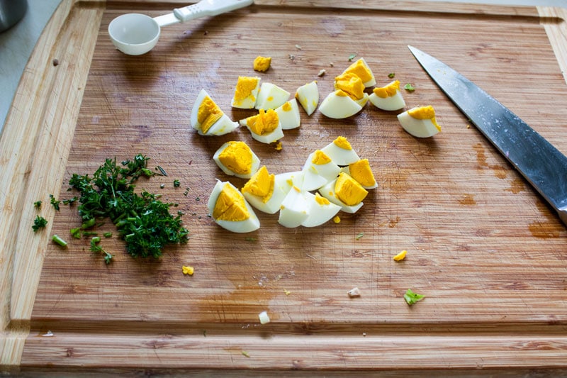  cut up red onion, celery and parsley on cutting board