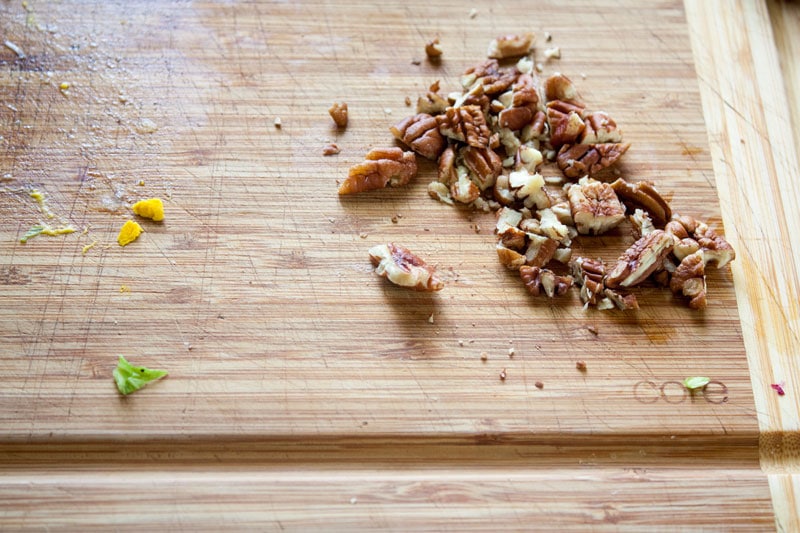 rough chopped pecans on board