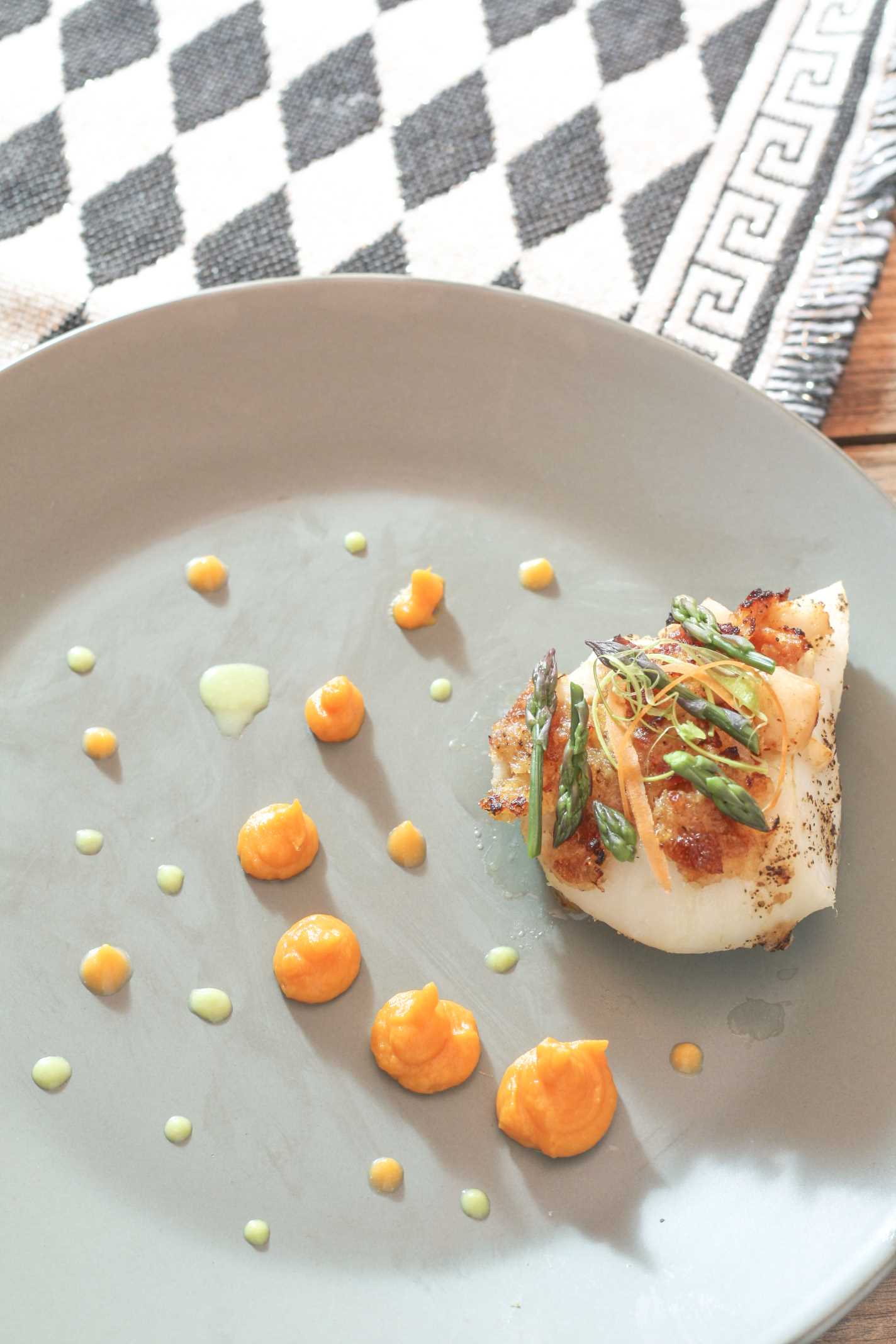 Bacon Horseradish Lobster Stuffed Grouper with sweet potato puree dotted on green plate
