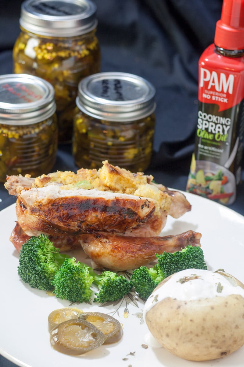 Cornish Hen cut in half with broccoli and potato