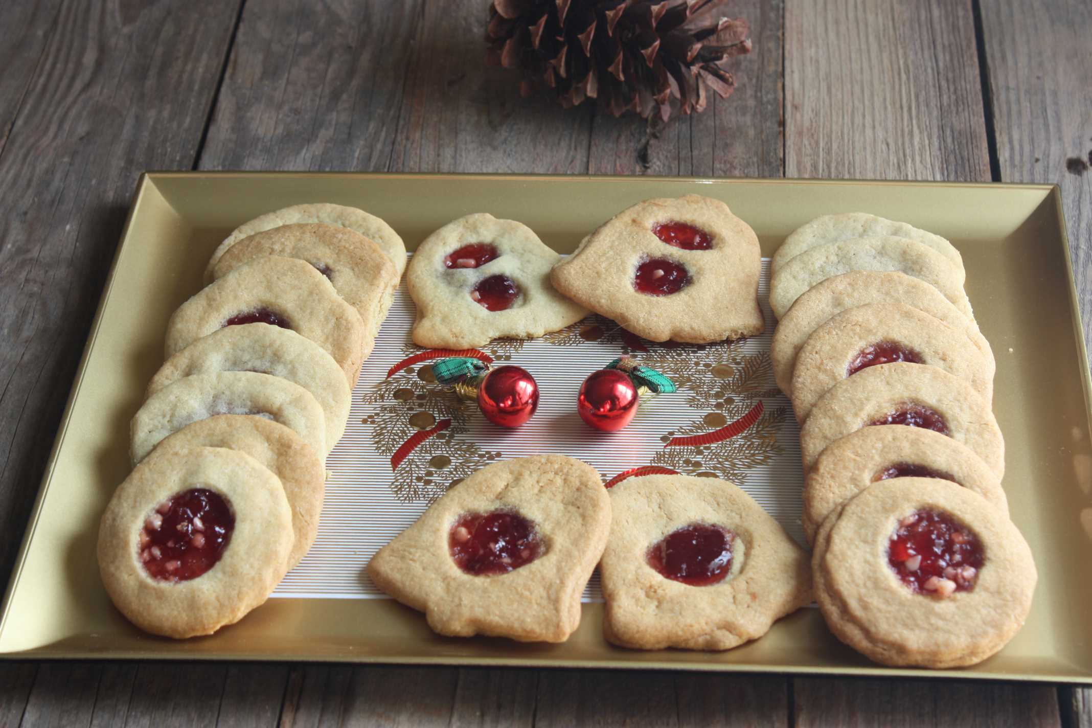Jam filled cookies on Gold and Red Christmas serving tray