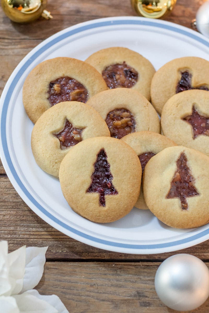 Jam filled cookies with Christmas Tree cutout, star cutout and circle cut out