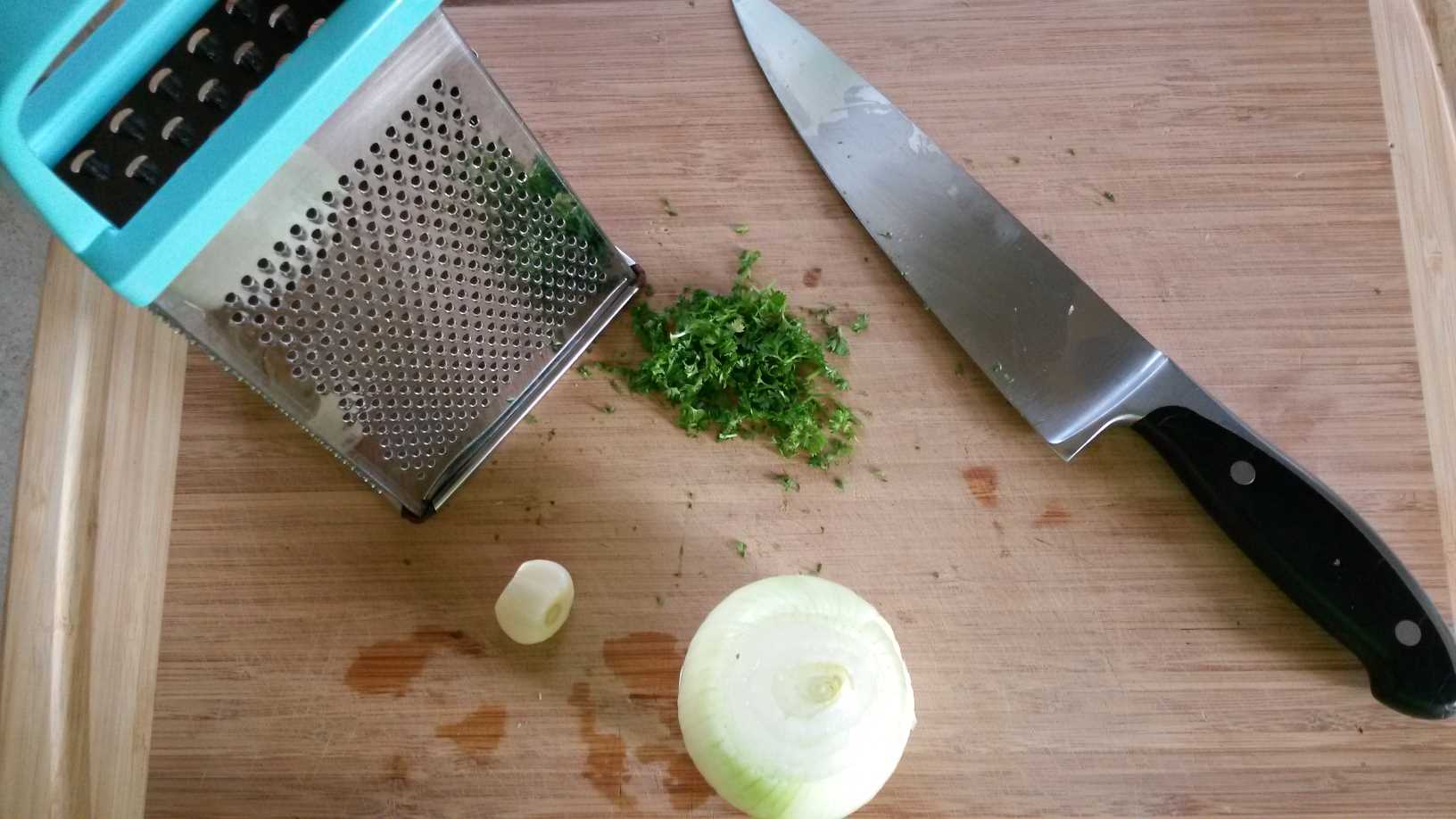 parsley onion and garlic on board