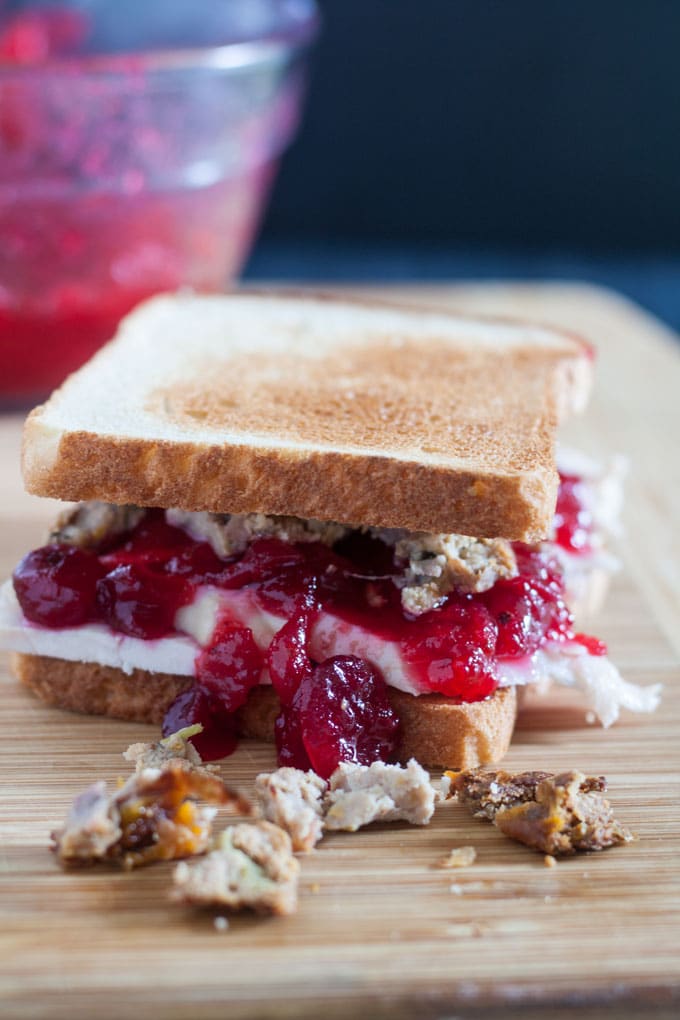 whole turkey sandwich dripping with cranberry sauce