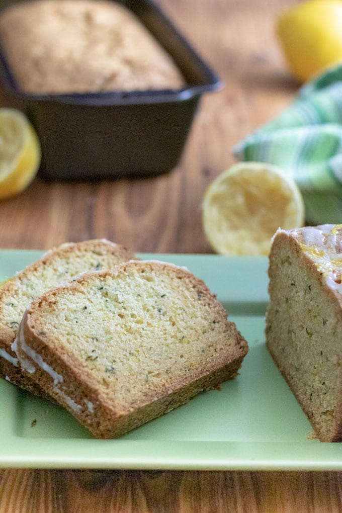 Slices of lemon zucchini bread on green platter