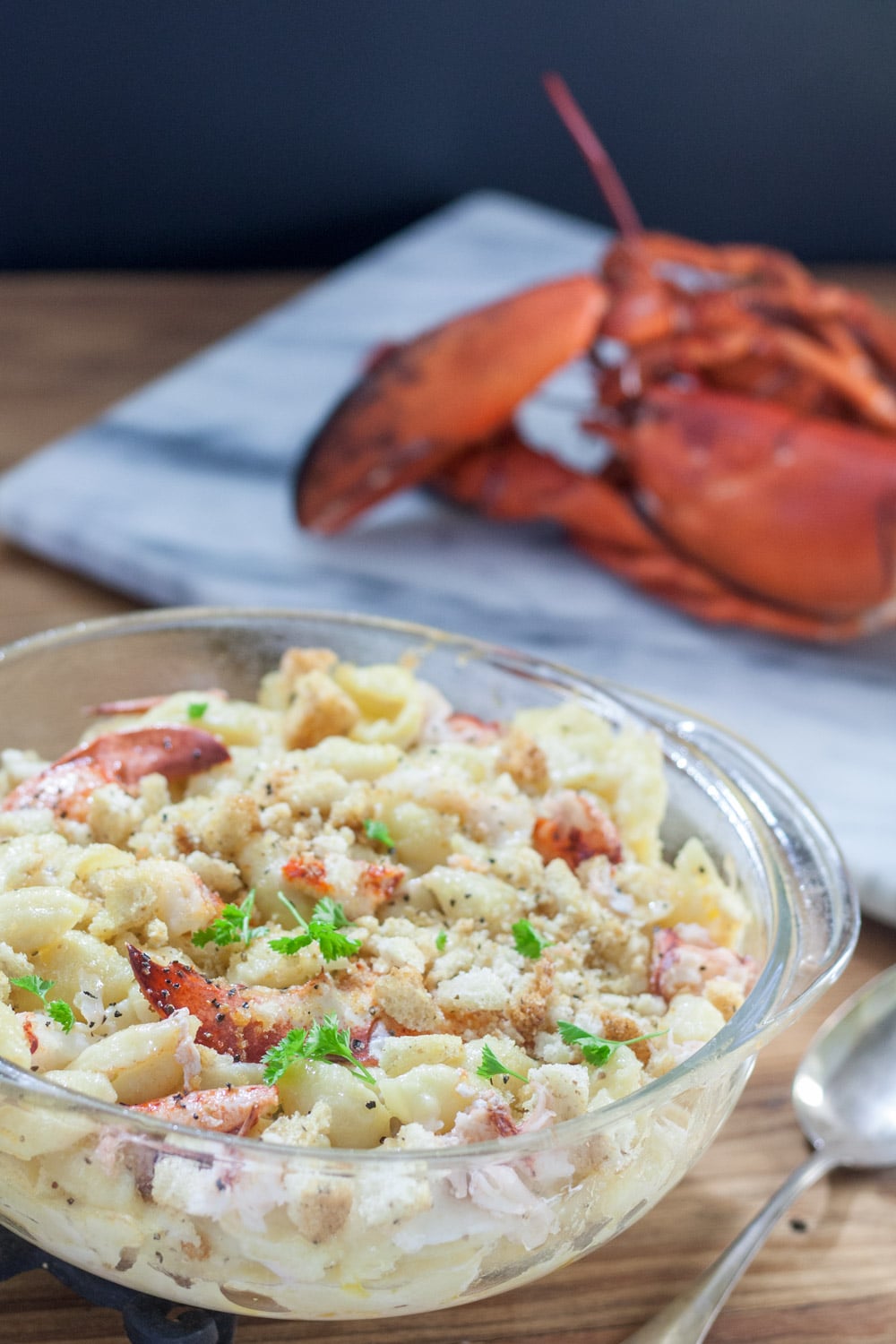 lobster macaroni and cheese in clear casserole with large chunks of lobster