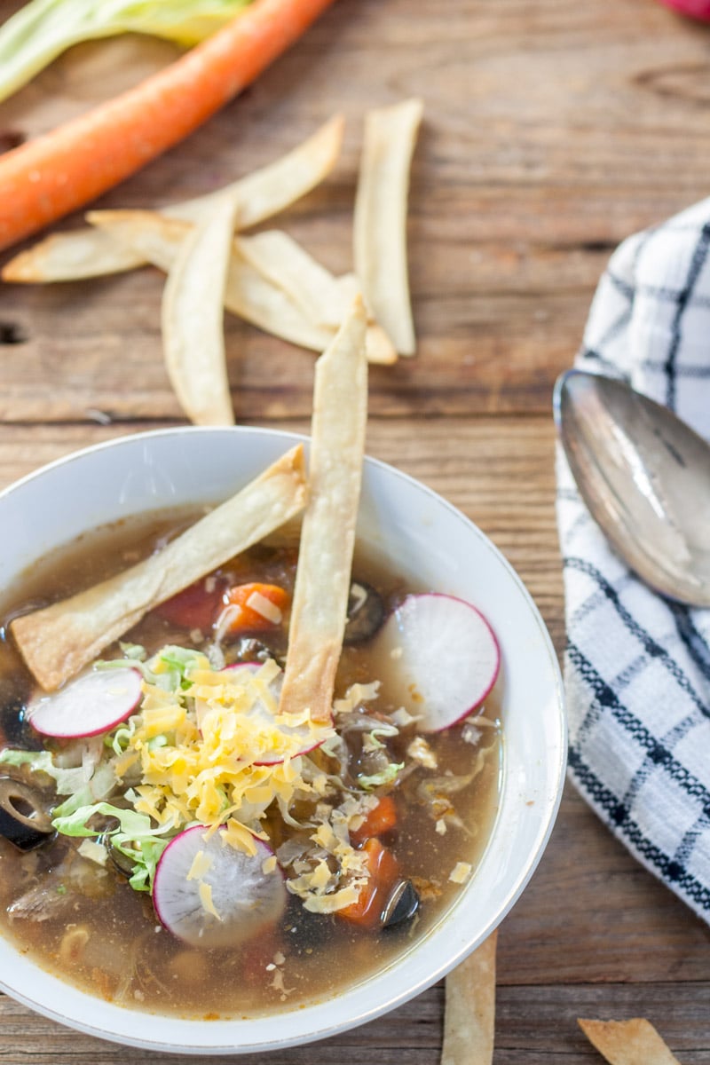 Close up Mexican turkey soup with tortilla chips