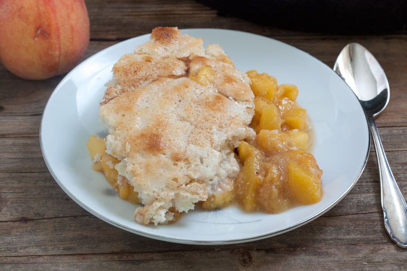 Southern Peach Cobbler on white plate.