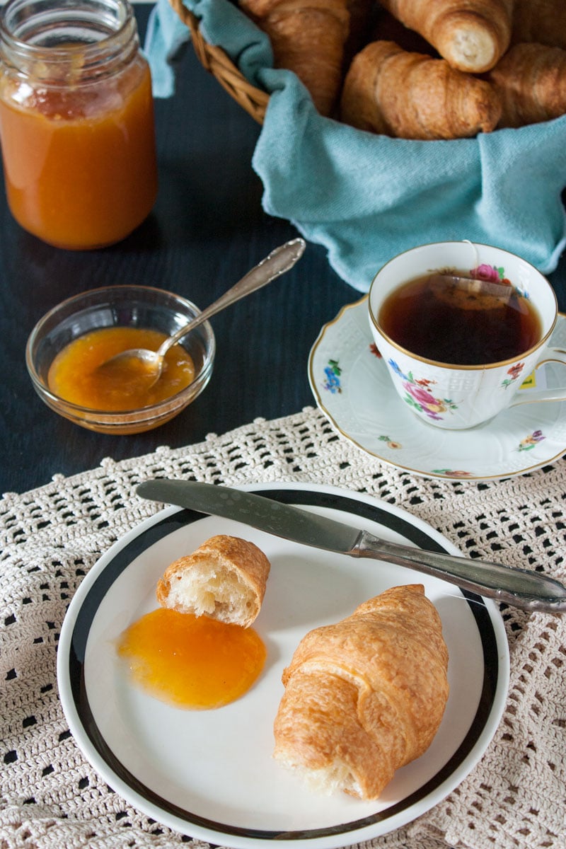 Peach jam with croissant and tea