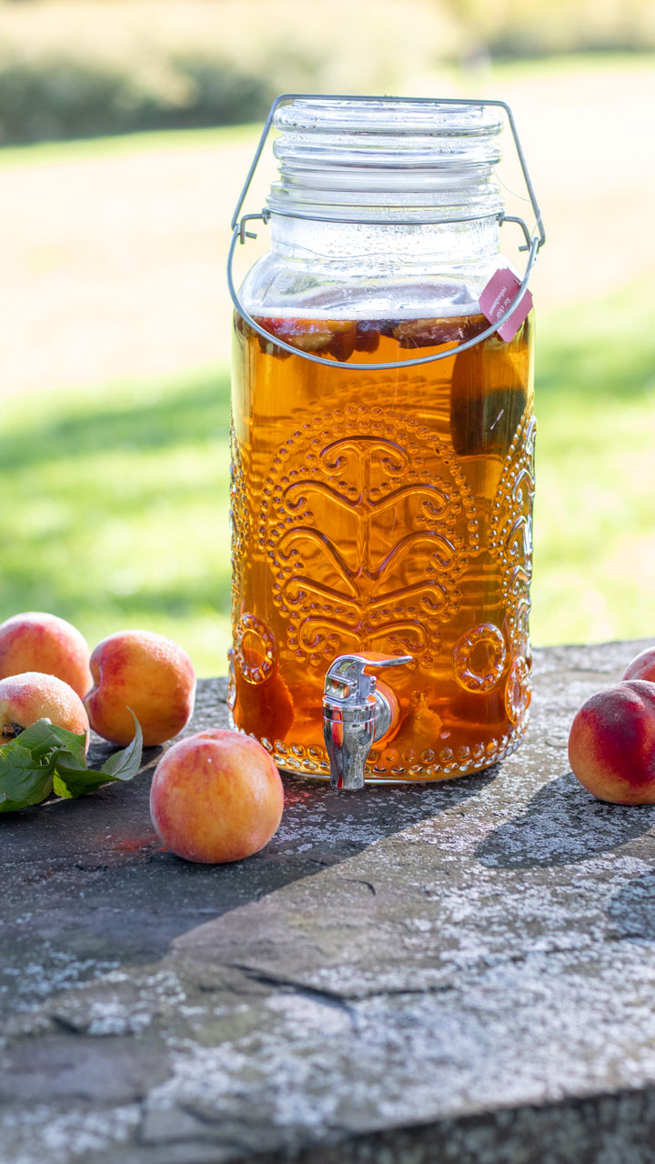 Beverage container with peach tea outside