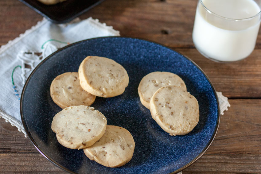 pecan sandies scattered on blue plate for 4th of july recipe