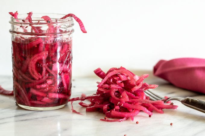 quick pickled onions on marble board