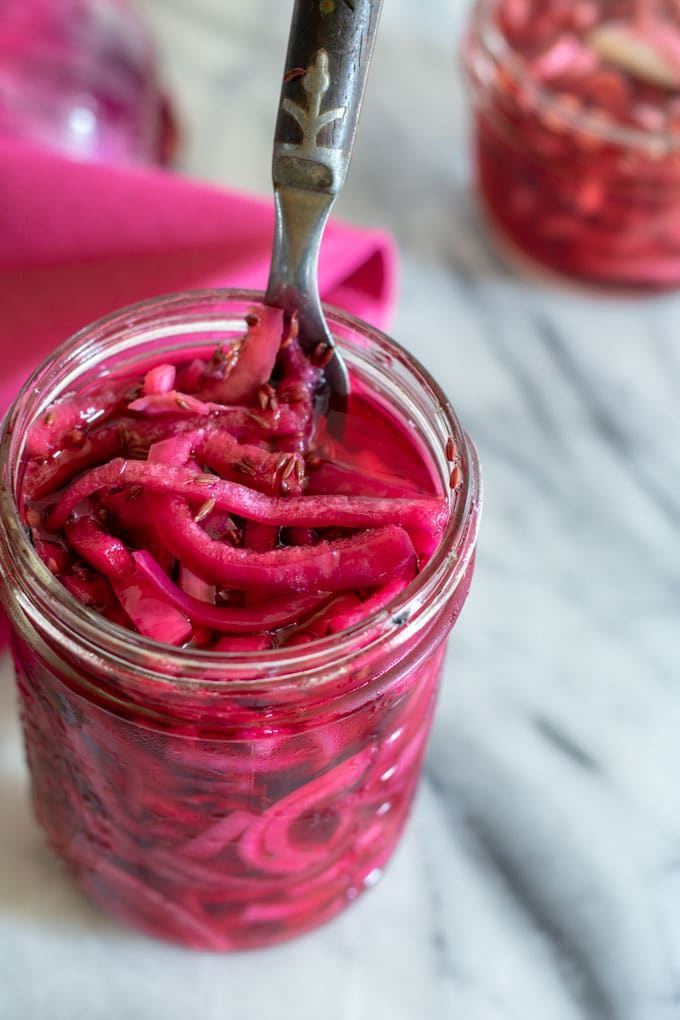 pickled onions on marble surface