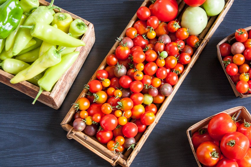 cherry tomatoes and peppers in baskets