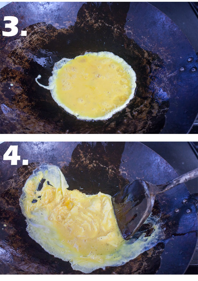 Eggs in wok. Stirring eggs.