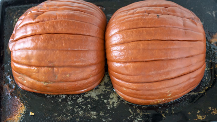 Roasted pumpkins on baking sheet.